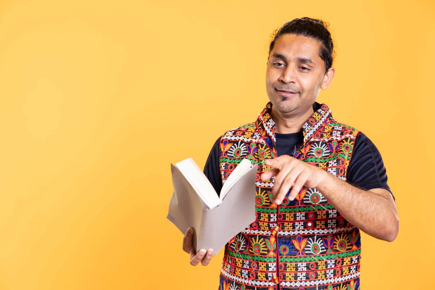 Hindi translator holding a book
