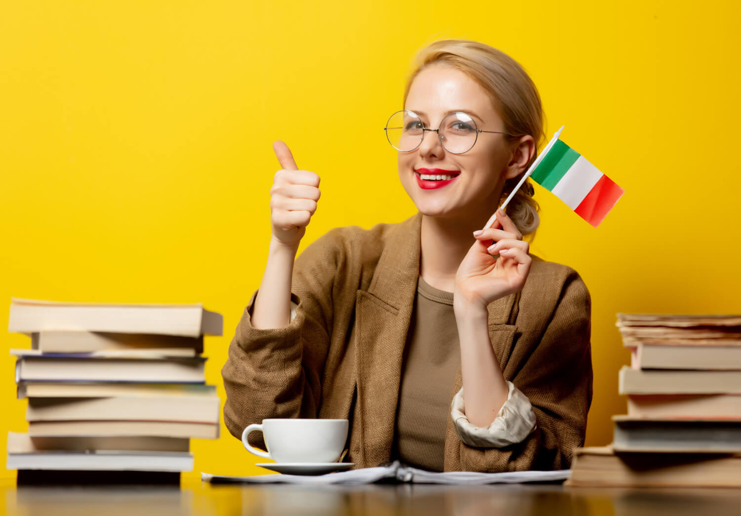 Italian translator holding a flag with books - Naric Org